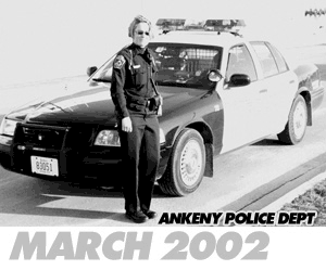 Officer Brennan, in front of patrol car, March 2002